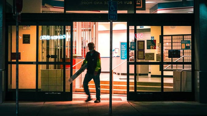 man exits post office