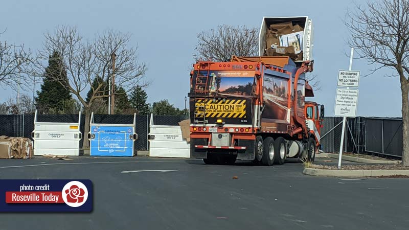 Cardboard recycling being emptied by truck in Roseville